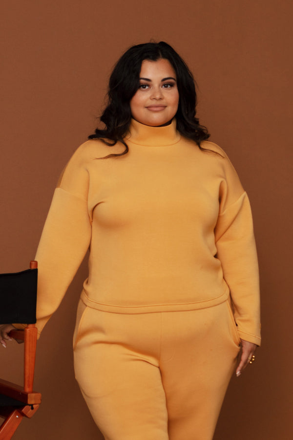 Woman wearing comfy yellow sweater