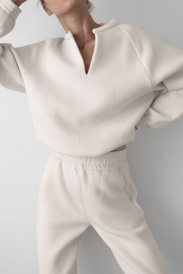 Woman wearing white comfy v-neck sweater